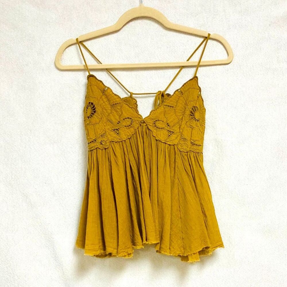 Free People lace up babydoll cami top. Size xs but can fit up to medium